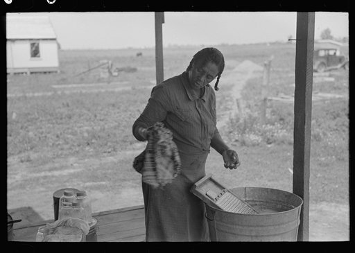 Untitled photo, possibly related to: Wife of sharecropper washing clothes, Southeast Missouri Farms