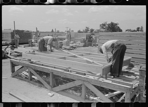 Porch plant. Finishing floor framing panel on the framing table. Southeast Missouri Farms Project