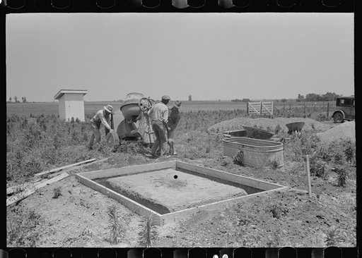 Food storage. Forms for foundations all ready for the pouring of concrete. Note that food storage building is almost completely above grade. Water table extremely high. Southeast Missouri Farms Project