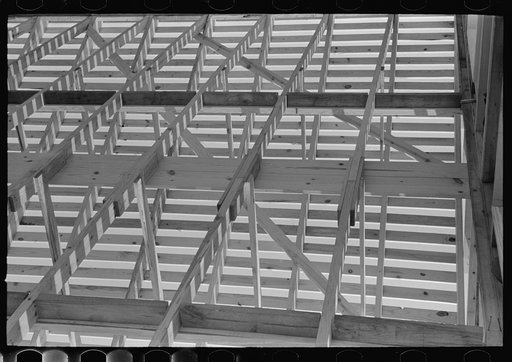 Southeast Missouri Farms Project. Interior view of roof trusses. Note nailers which space ceiling joists for ceiling board
