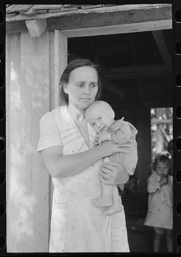 Wife and child of sharecropper, cut-over farmer in bottoms of Mississippi River