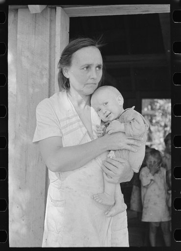 Wife and child of sharecropper, cut-over farmer in bottom lands of Mississippi River