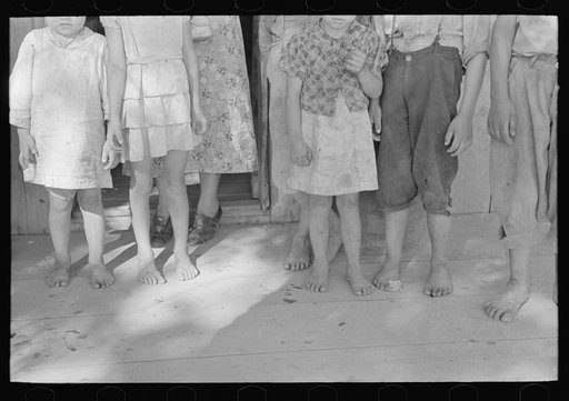 Feet and clothing of family of sharecropper, cut-over farmer of Mississippi bottoms