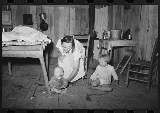 Interior of house without windows, home of sharecropper, cut-over farmer of Mississippi bottoms