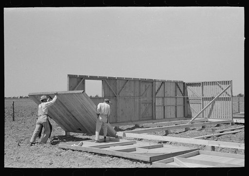 Barn erection. Tipping up panel directly from point of delivery. Southeast Missouri Farms Project