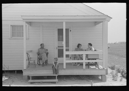 Southeast Missouri Farms. FSA (Farm Security Administration) clients on front porch of new home