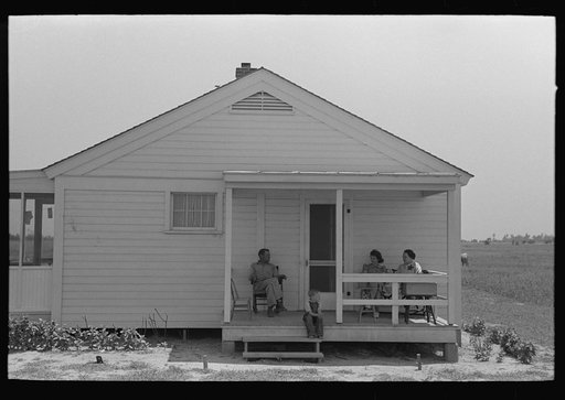Southeast Missouri Farms. FSA (Farm Security Administration) clients on front porch of new home