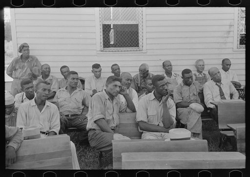 Negro clients listening to visiting public health official, Southeast Missouri Farms. La Forge, Missouri