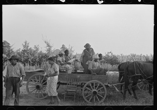 Untitled photo, possibly related to: Negro clients arriving in wagon at meeting, Southeast Missouri Farms.
