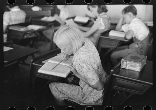 Untitled photo, possibly related to: Child studying in school, Southeast Missouri Farms