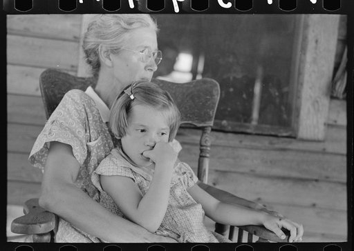 Background photo. Wife of FSA (Farm Security Administration) client with daughter. They will participate in tenant purchase program