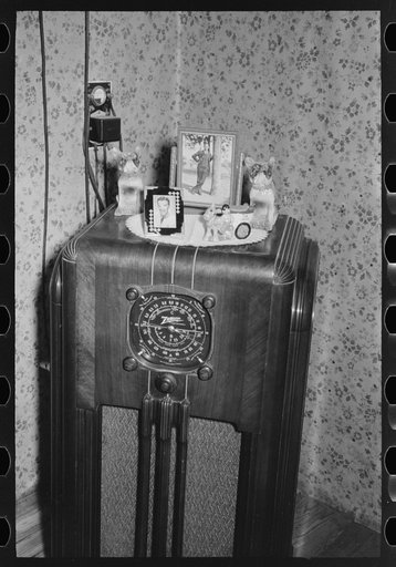 Radio with ornaments and decorations in home of FSA (Farm Security Administration) client near Caruthersville, Missouri