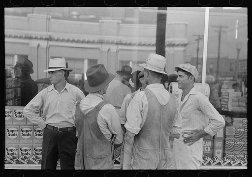Group of farmers talking in street, Caruthersville, Missouri