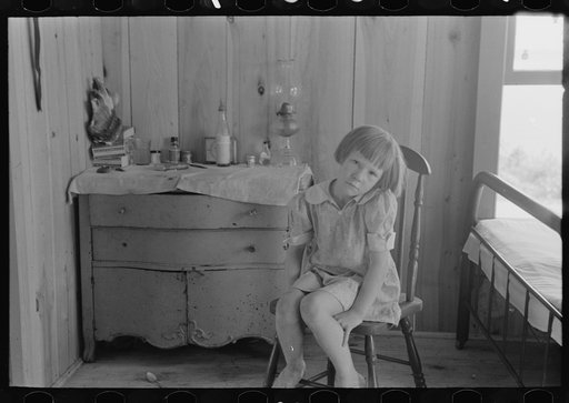 Child of relief worker living in two-room shack home, Caruthersville, Missouri