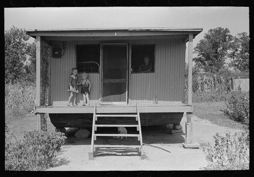 Untitled photo, possibly related to: House on river side of levee near Caruthersville, Missouri. Note this is adaptation of house boat