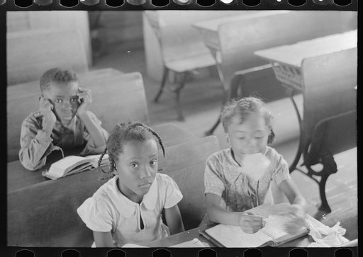 Untitled photo, possibly related to: Schoolteacher explaining passage to pupil, La Forge, Missouri. School attended by Southeast Missouri Farms children