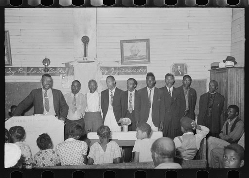 Negro revival meeting, showing preacher and deacons, La Forge, Missouri