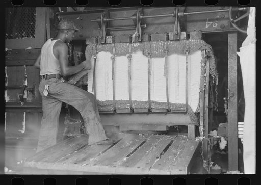 Untitled photo, possibly related to: Painting identification marks on a bale of cotton, Lehi, Arkansas