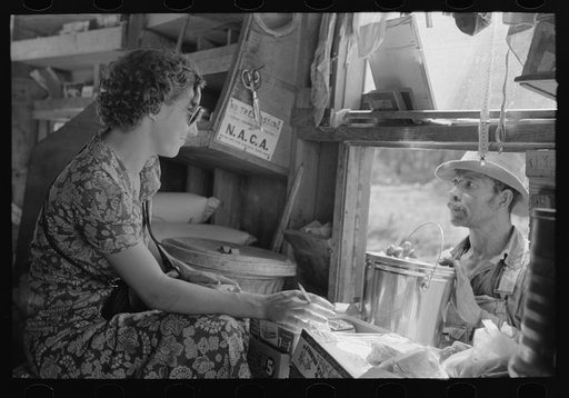 Untitled photo, possibly related to: Negro making purchase at traveling grocery store, Forrest City, Arkansas