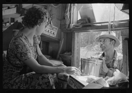 Negro making purchase at traveling grocery store, Forrest City, Arkansas