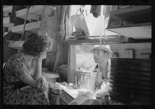Untitled photo, possibly related to: Negro making purchase at traveling grocery store, Forrest City, Arkansas