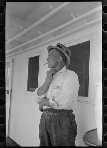 Untitled photo, possibly related to: Oyster fisherman of Olga, Louisiana, aboard El Rito. Captain of this boat gives free beer to fishermen on his stops