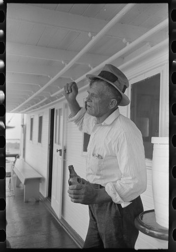 Oyster fisherman of Olga, Louisiana, aboard El Rito. Captain of this boat gives free beer to fishermen on his stops