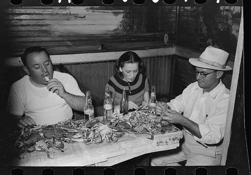 Residents of Raceland, Louisiana, eating crabs at crab boil