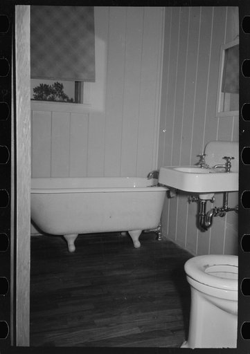 Untitled photo, possibly related to: Child in bed in farm home, Lake Dick Project, Arkansas