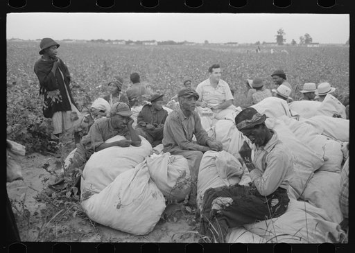Untitled photo, possibly related to: Day laborers, cotton pickers, waiting to be paid off at end of day's work. Lake Dick Project, Arkansas