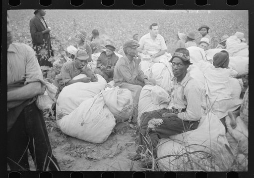 Day laborers, cotton pickers, waiting to be paid off at end of day's work. Lake Dick Project, Arkansas