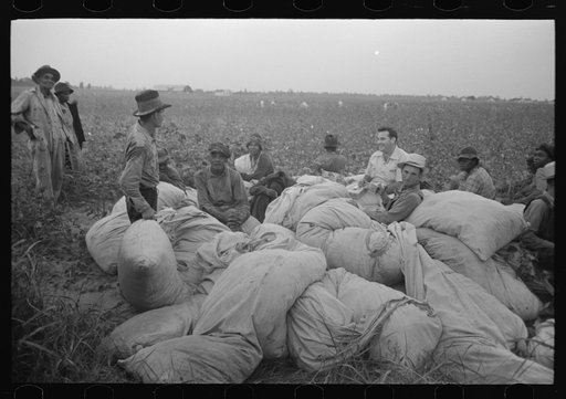 Untitled photo, possibly related to: Day laborers, cotton pickers, waiting to be paid off at end of day's work. Lake Dick Project, Arkansas