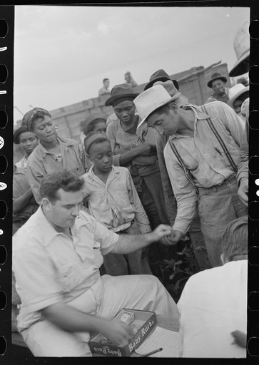 Cotton pickers being paid off, Lake Dick Project, Arkansas