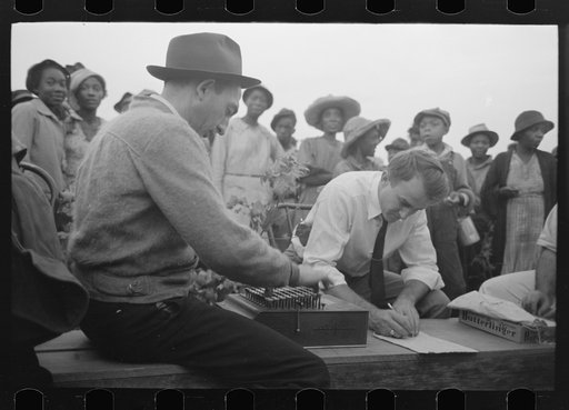 Members of Lake Dick Project paying off cotton pickers, Arkansas