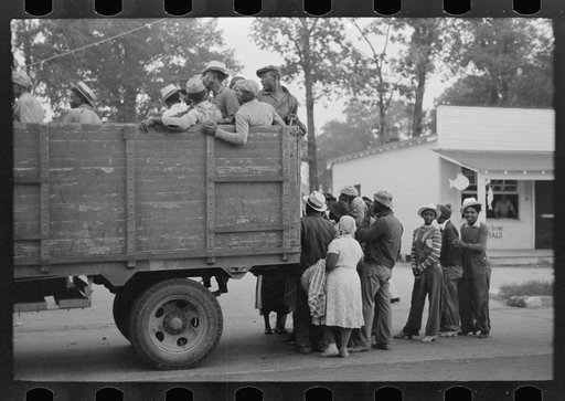 Cotton pickers being loaded onto truck for transportation to fields, Pine Bluff, Arkansas