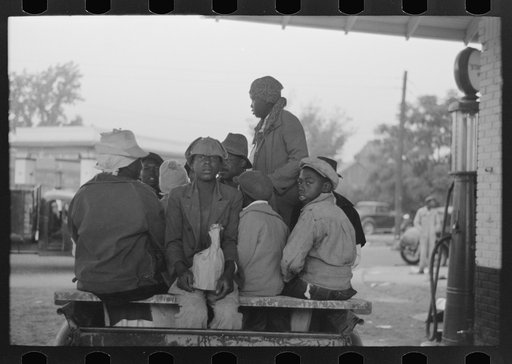 Untitled photo, possibly related to: Cotton pickers boarding truck which will take them to the fields, Pine Bluff, Arkansas