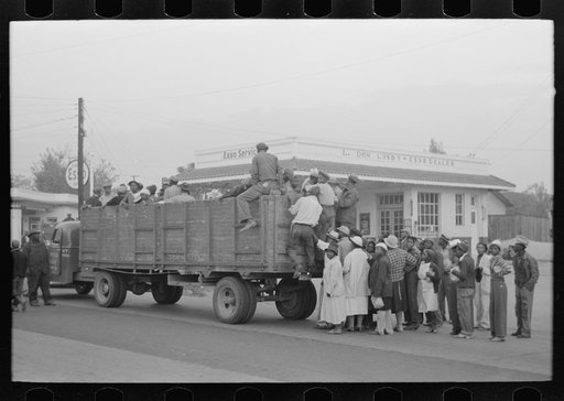 Untitled photo, possibly related to: Cotton pickers boarding truck which will take them to the fields, Pine Bluff, Arkansas