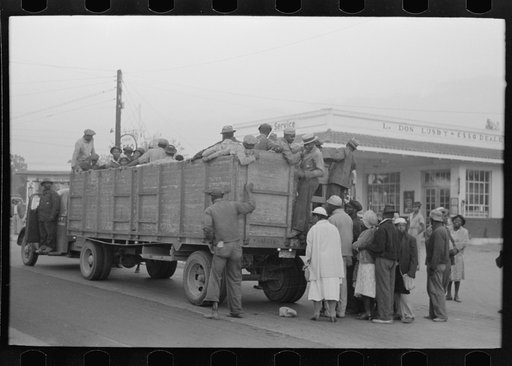 Cotton pickers boarding truck which will take them to the fields, Pine Bluff, Arkansas