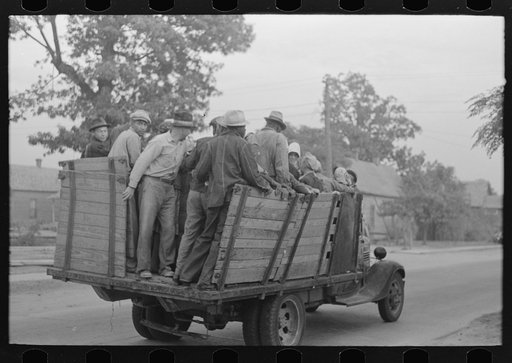 Untitled photo, possibly related to: Cotton pickers boarding truck which will take them to the fields, Pine Bluff, Arkansas