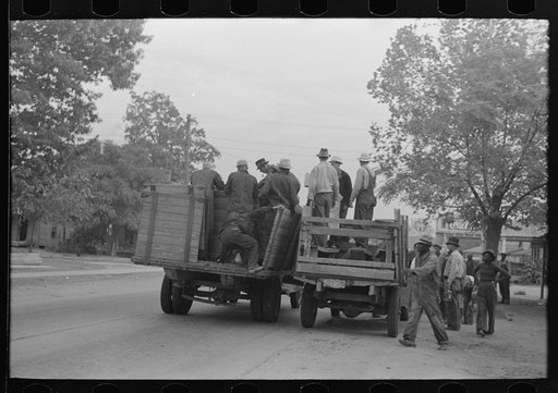 Untitled photo, possibly related to: Cotton pickers boarding truck which will take them to the fields, Pine Bluff, Arkansas