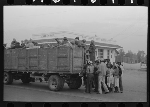 Untitled photo, possibly related to: Cotton pickers boarding truck which will take them to the fields, Pine Bluff, Arkansas