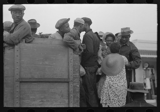Untitled photo, possibly related to: Helping women cotton pickers board truck, Pine Bluff, Arkansas