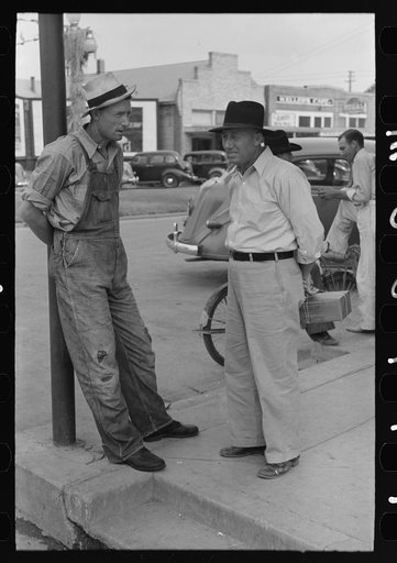 Farmers talking on street corner, Crowley, Louisiana