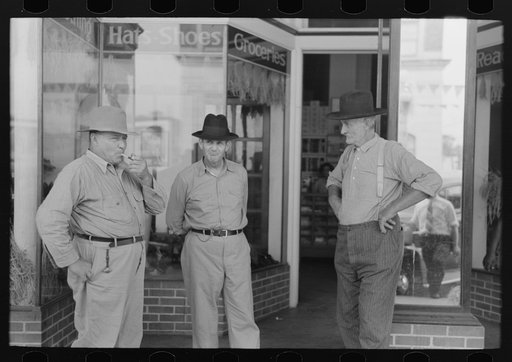 Farmers talking in front of old store, Crowley, Louisiana