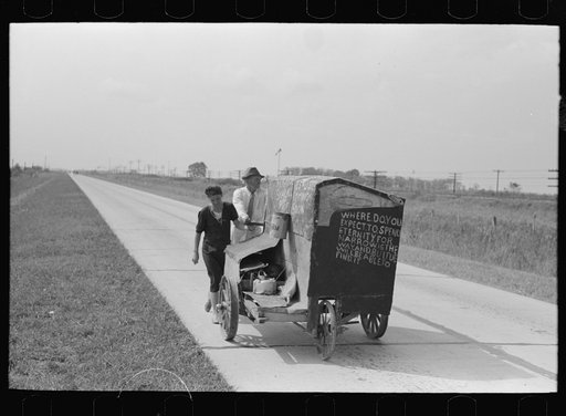 Untitled photo, possibly related to: Traveling evangelists pushing cart on road between Lafayette and Scott, Louisiana