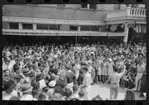 Untitled photo, possibly related to: As soon as entrance to platform is left unguarded there was a great rush of people to get better view. National Rice Festival, Crowley, Louisiana