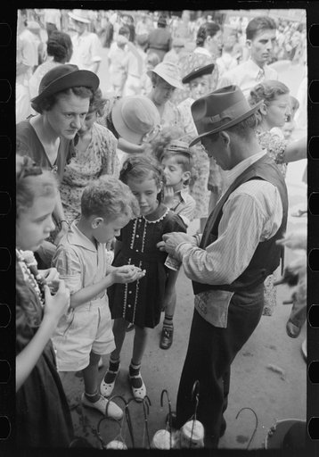 Untitled photo, possibly related to: People standing on sidewalk watching parade, National Rice Festival, Crowley, Louisiana