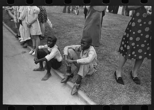 Untitled photo, possibly related to: People waiting on sidewalk for parade, National Rice Festival, Crowley, Louisiana