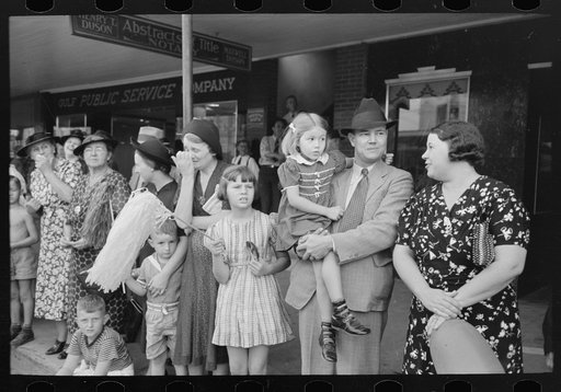 Untitled photo, possibly related to: People waiting on sidewalk for parade, National Rice Festival, Crowley, Louisiana