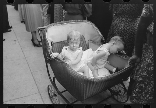 Two children in buggy, National Rice Festival, Crowley, Louisiana